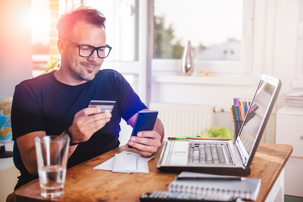 Man inputting Payment information into secure portal